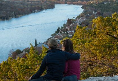 couple watching sunset at mt. bonnell